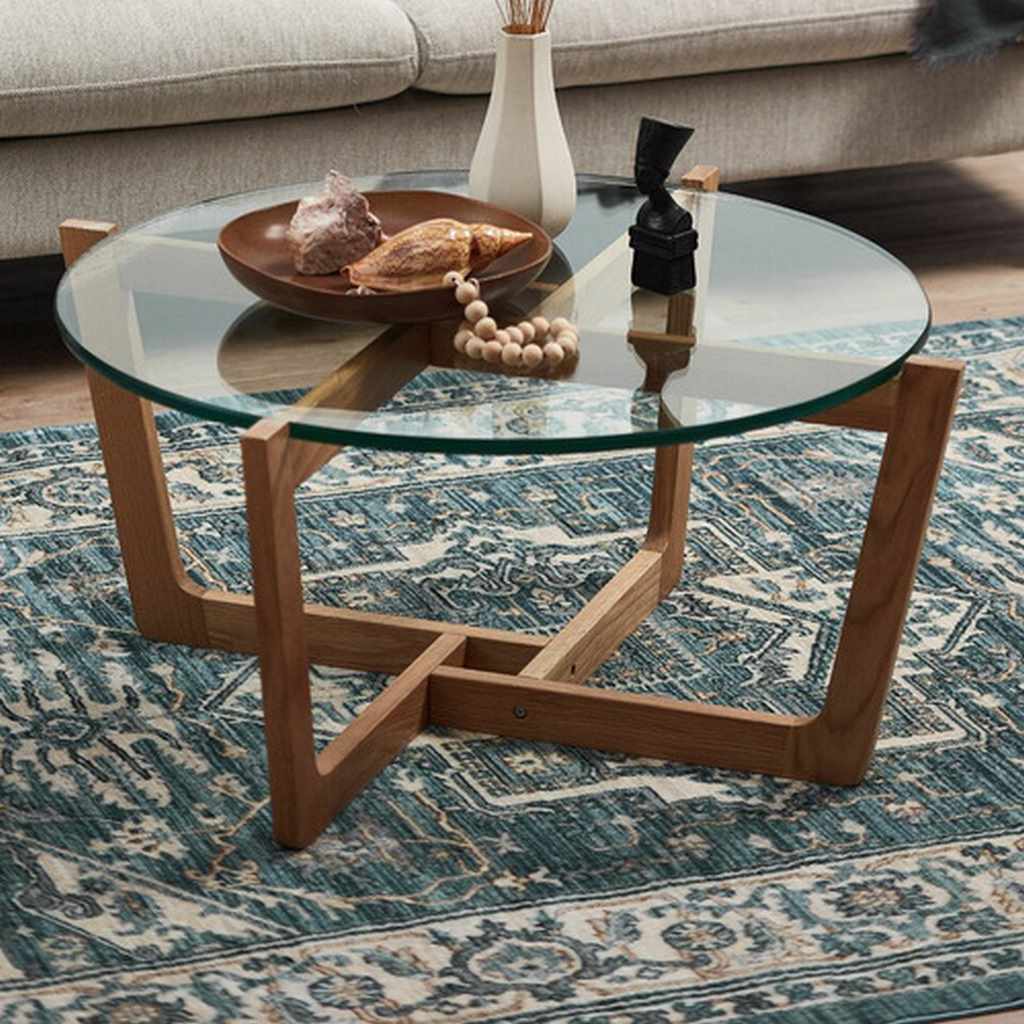 glass coffee table with ceramic decor